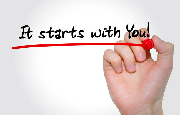 It starts with you is written in black letters and underlined in red. At the end of the underline is a hand holding a red marker. 