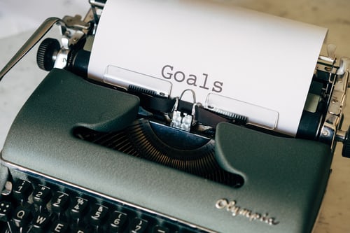 An old fashioned typewriter with the word Goals typed on paper in teh typewriter. Learning styles